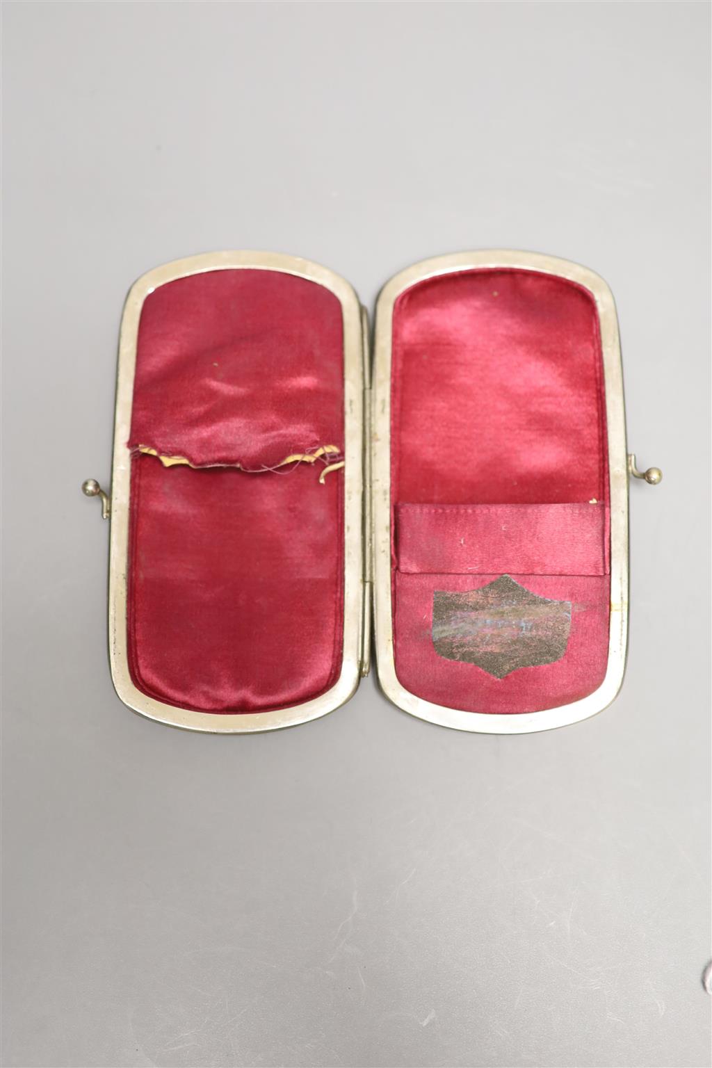 A 19th century mother of pearl figuratively carved purse/case, height 12cm